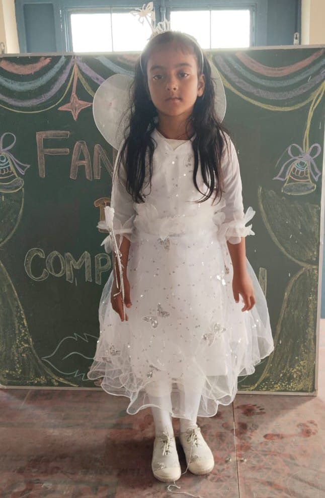 Girl in fairy costume holding a wand